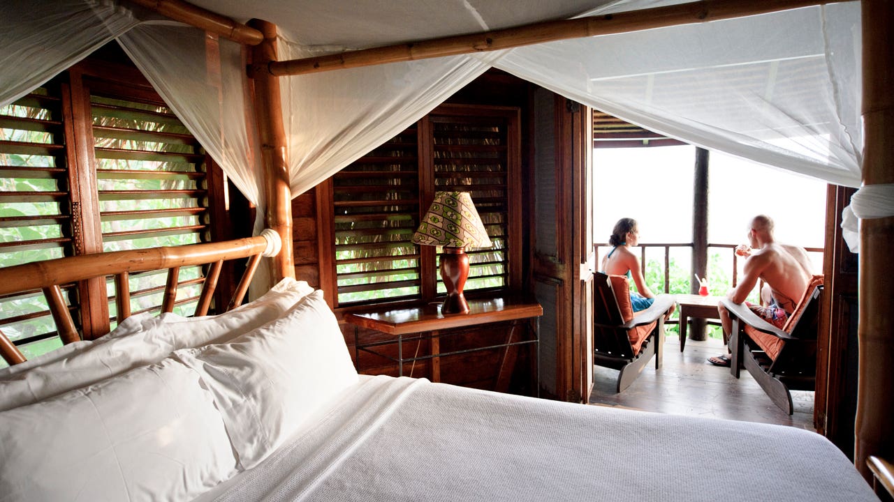 couple sitting on hotel room balcony