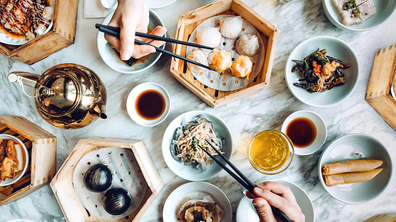 people eating dim sum