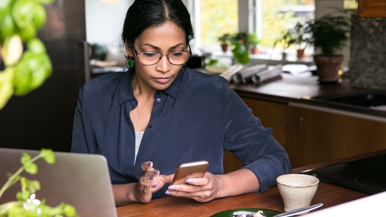 woman looking at her phone