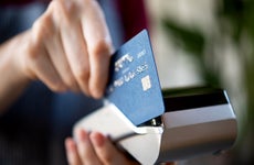 waitress swiping a credit card