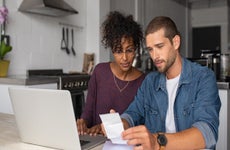 Couple reviewing bills, managing finances