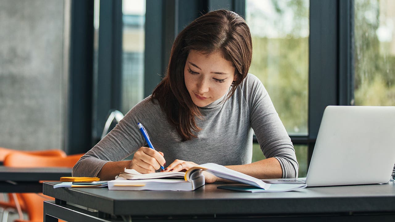 student working in the library