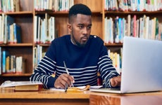 college student working in the library