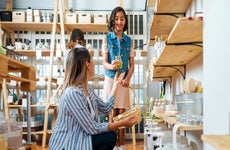 mother and young daughter shopping together in a store