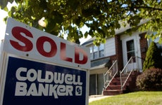 Coldwell Banker "Sold" sign outside of a home