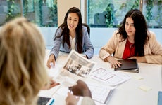 two realtors discussing properties with a client