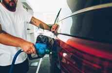 man pumping gas into his car