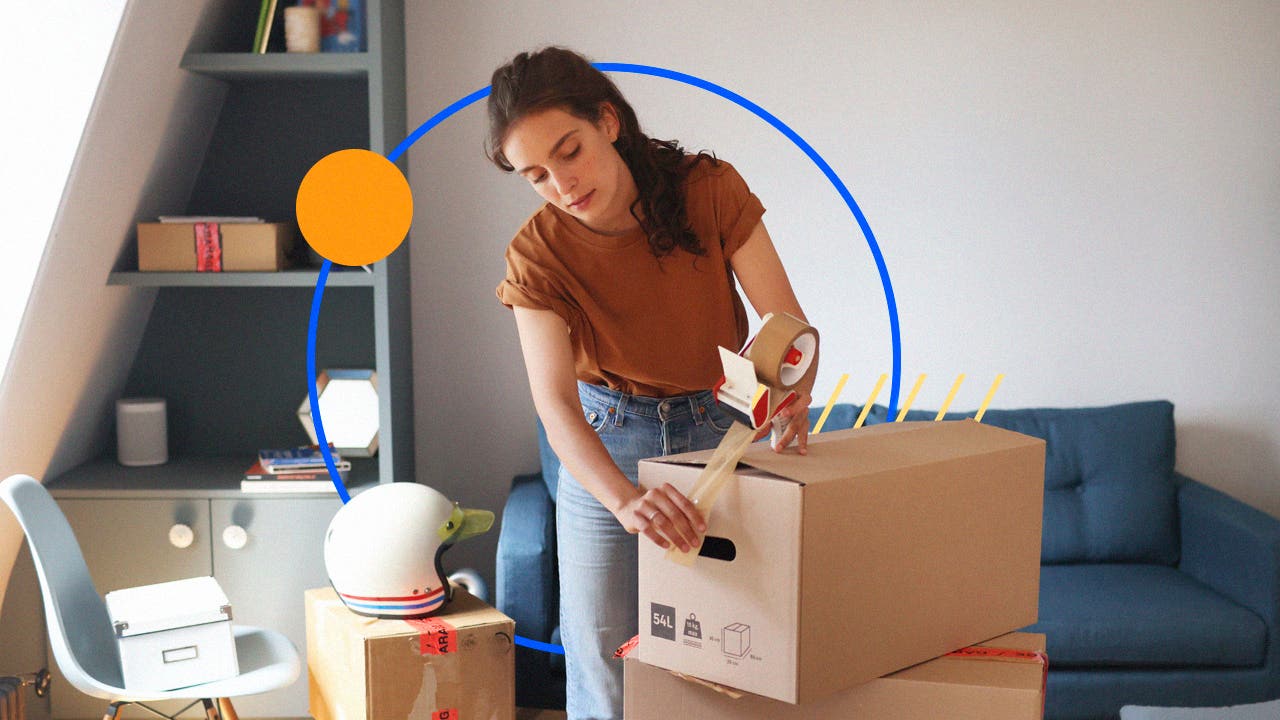 Woman using packing tape to seal boxes