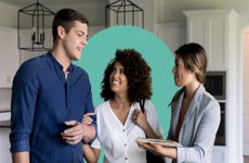 Couple chatting with a real estate agent