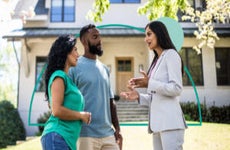 couple discussing making a counter-offer on a home with their realtor