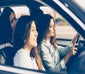 Group of young women in a car going for a drive