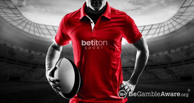 a player wearing a Betiton Sport rugby betting shirt and holding a rugby ball in his hand