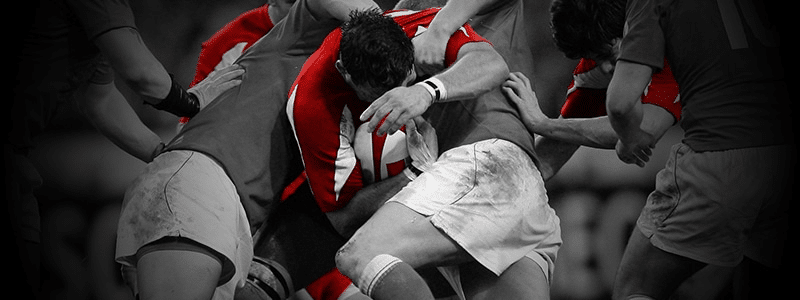 rugby players tackling