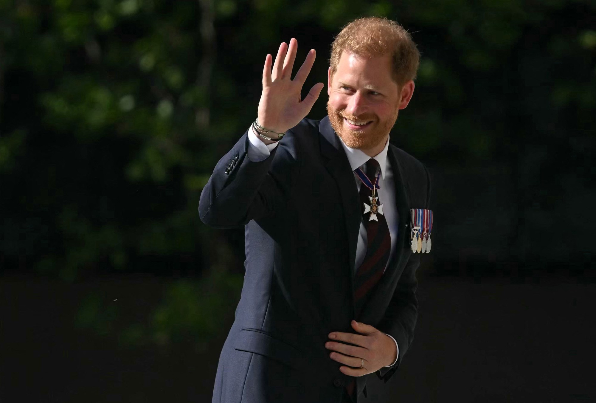 TOPSHOT - Britain's Prince Harry, Duke of Sussex waves as he arrives to attend a ceremony marking the 10th anniversary of the Invictus Games, at St Paul's Cathedral in central London, on May 8, 2024. (Photo by JUSTIN TALLIS / AFP) (Photo by JUSTIN TALLIS/AFP via Getty Images)