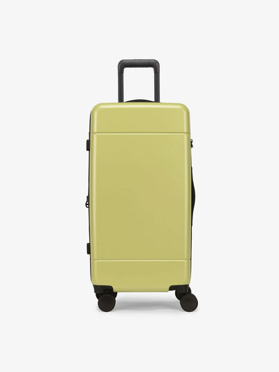 CALPAK Hue Medium Trunk Luggage with durable hard-shell exterior, cushioned top handle and 360 spinner wheels in key lime; LHU1026-KEY-LIME view 1