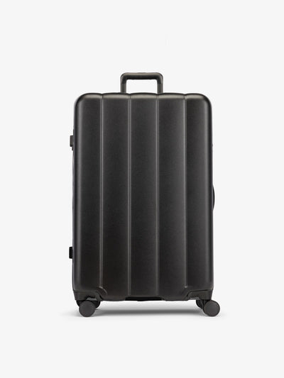 Black CALPAK large luggage made from an ultra-durable polycarbonate shell and expandable by up to 2; LCO1028-BLACK view 1