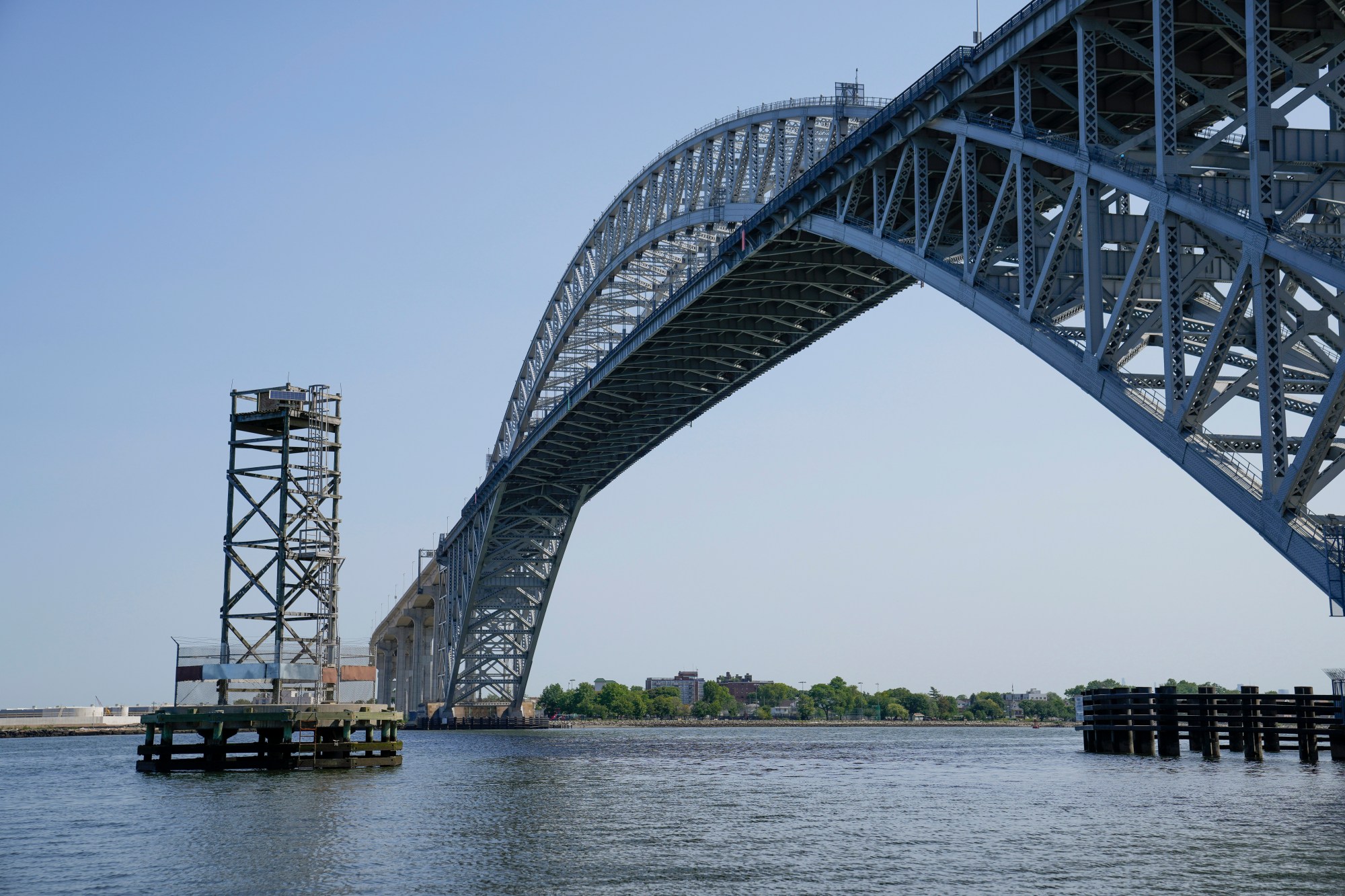 A purpose-built nesting tower for Peregrine Falcon's stands beside the Bayonne Bridge on the Kill Van Kull tidal strait, Tuesday, May 30, 2023, in the Staten Island borough of New York. The nest contains four chicks, all about 24 days old, the ideal age for the application of identification bands. The nest was built to provide a safe shelter for the extremely aggressive birds who would otherwise breed on the nearby bridge and pose a danger to maintenance workers. (AP Photo/John Minchillo)