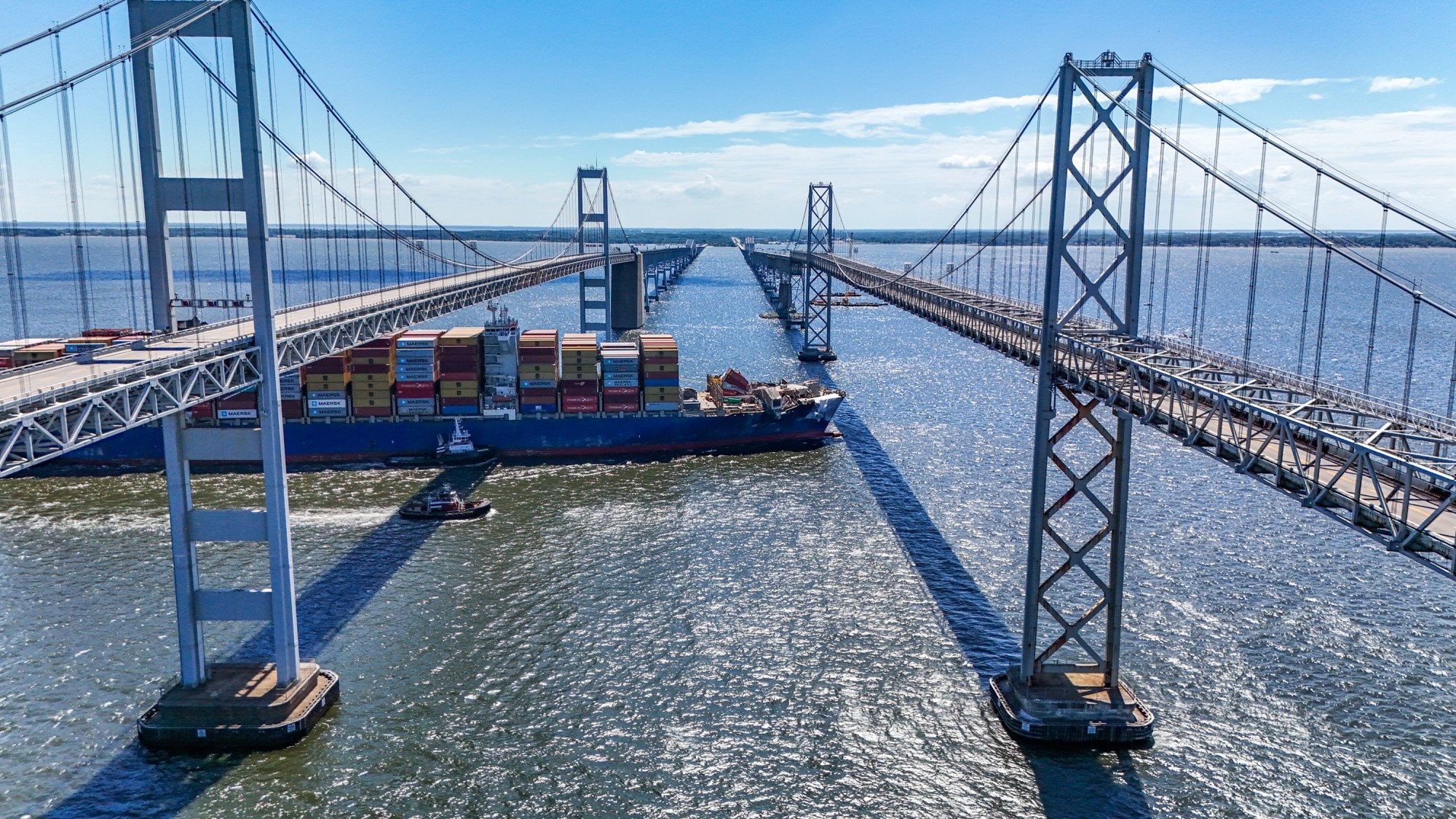 The container ship Dali passes below an empty Chesapeake Bay Bridge on its way to Norfolk. Traffic was stopped briefly for the Dali's passage as a precaution. Ninety days ago the ship hit a support pier of the bridge causing a catastrophic collapse.
