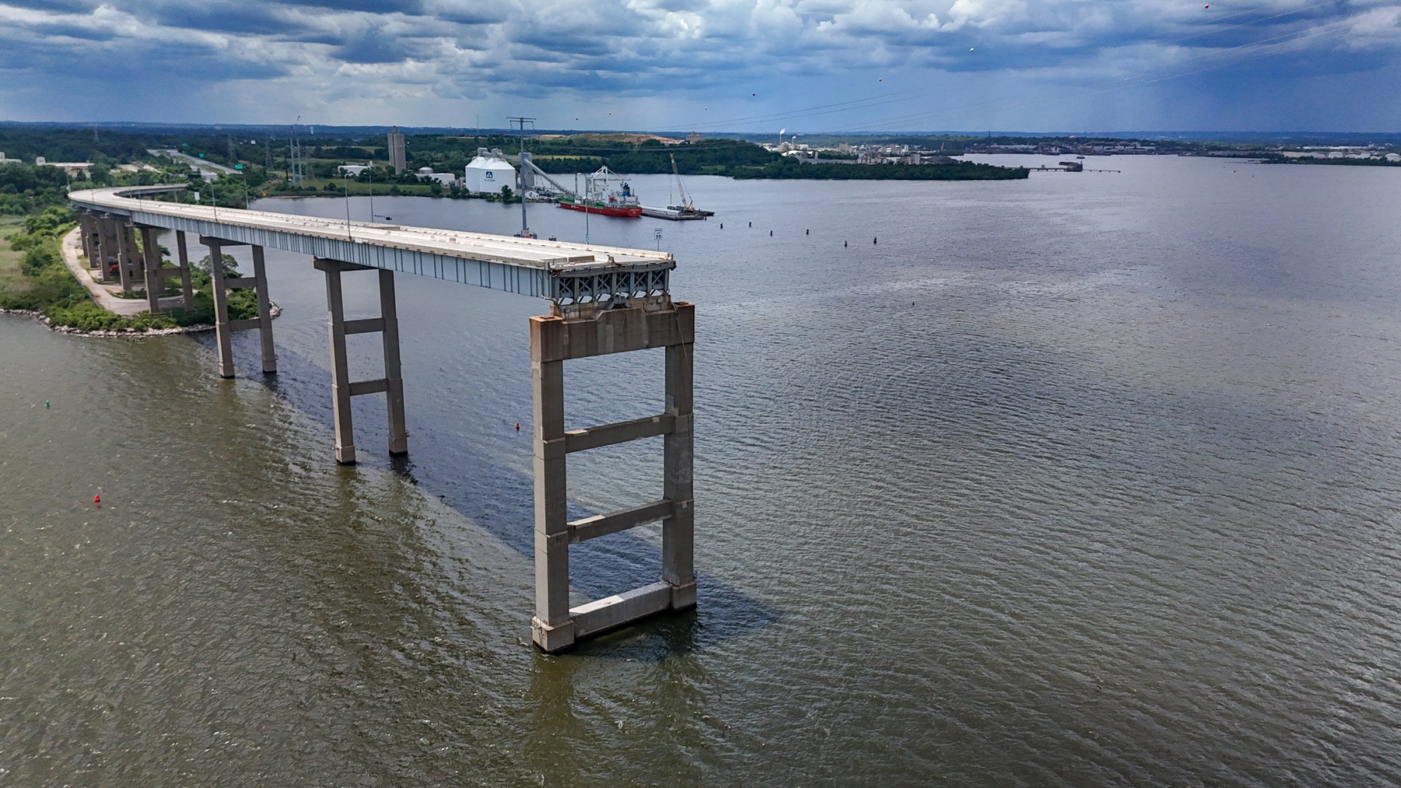 The ramp to the Francis Scott Key Bridge is seen on the southwest side of the Patapsco River two months after the catastrophic bridge collapse.
