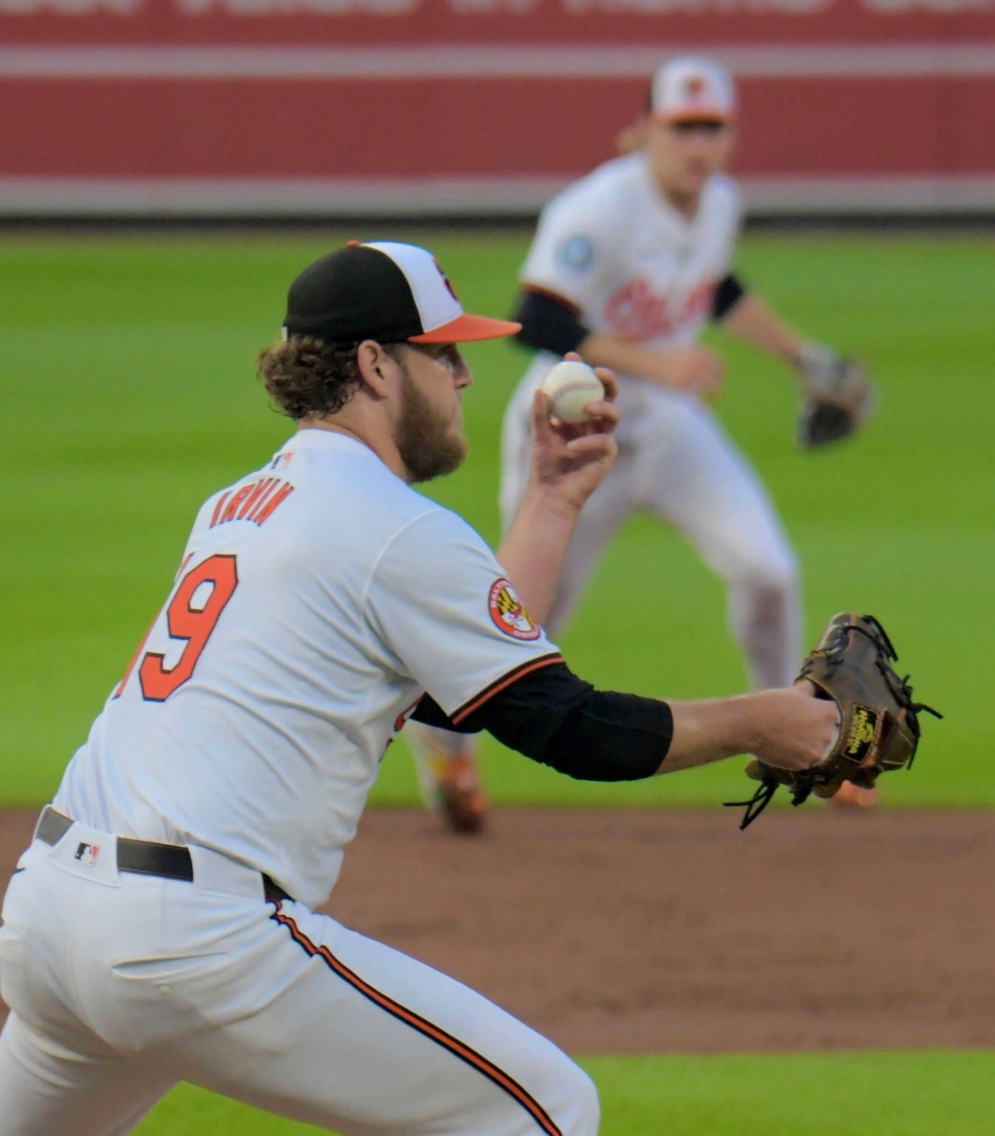 Orioles' Cole Irvin snares a come backer by Texas batter Adolis García at Oriole Park at Camden Yards. (Karl Merton Ferron/staff)