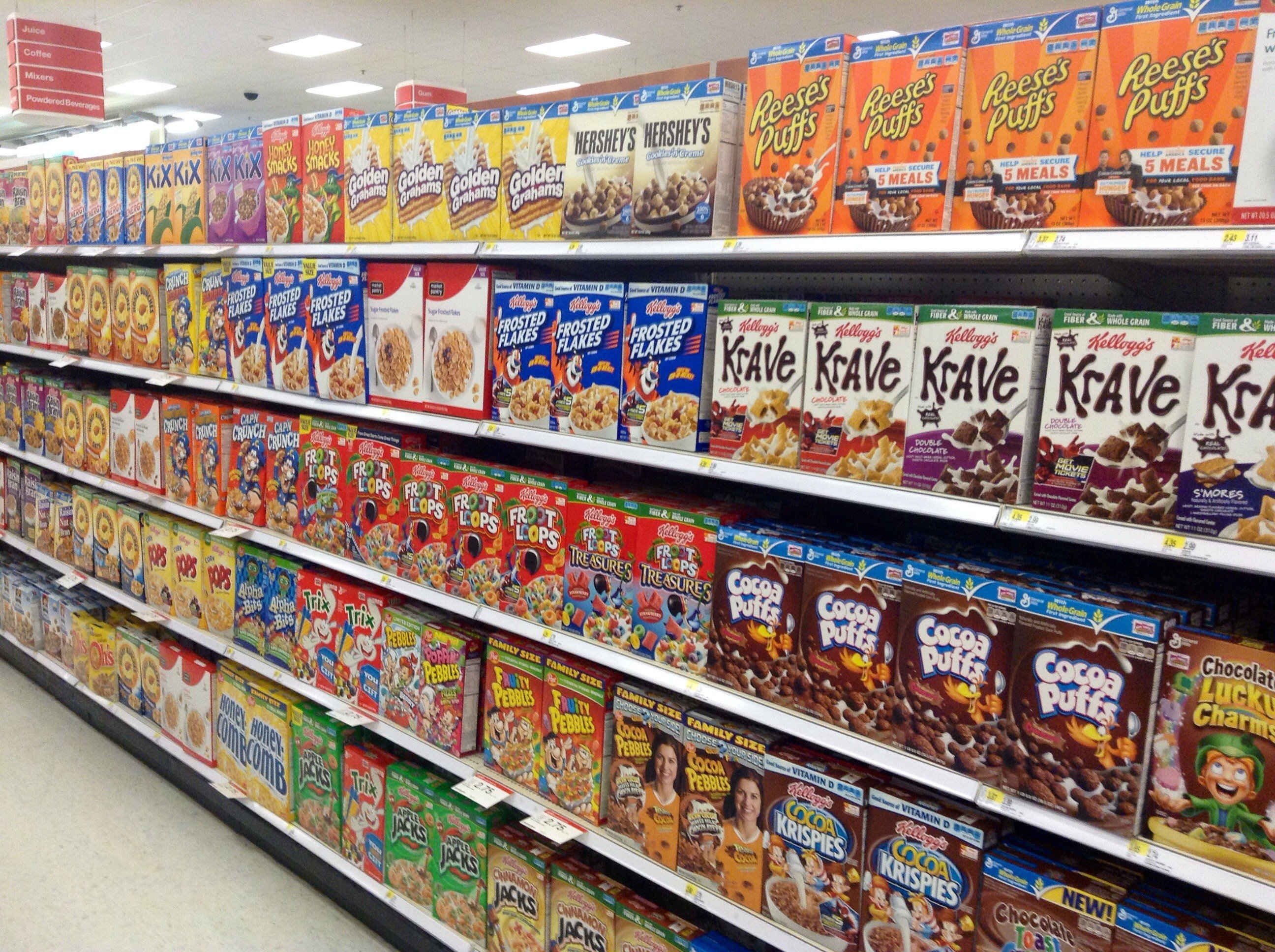 Breakfast cereals in aisle of supermarket.