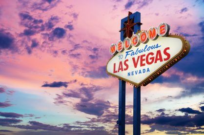 Welcome to Fabulous Las Vegas, Nevada Sign with sunset background.