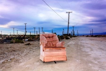 Old armchair outside in Salton City, California, United States.