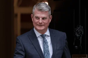 UK Gambling Minister Stuart Andrew in a doorway