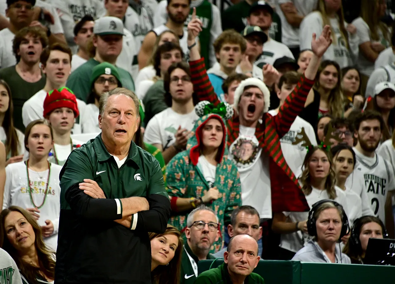 Michigan State Spartans head coach Tom Izzo and fans watch the action against the Brown Bears in the second half at Jack Breslin Student Events Center.