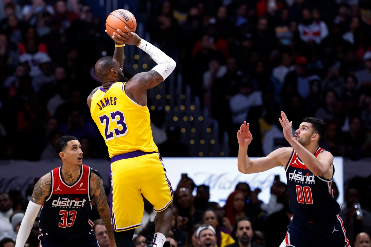 Los Angeles Lakers forward LeBron James (23) shoots the ball over Washington Wizards forward Tristan Vukcevic (00) at Capital One Arena.