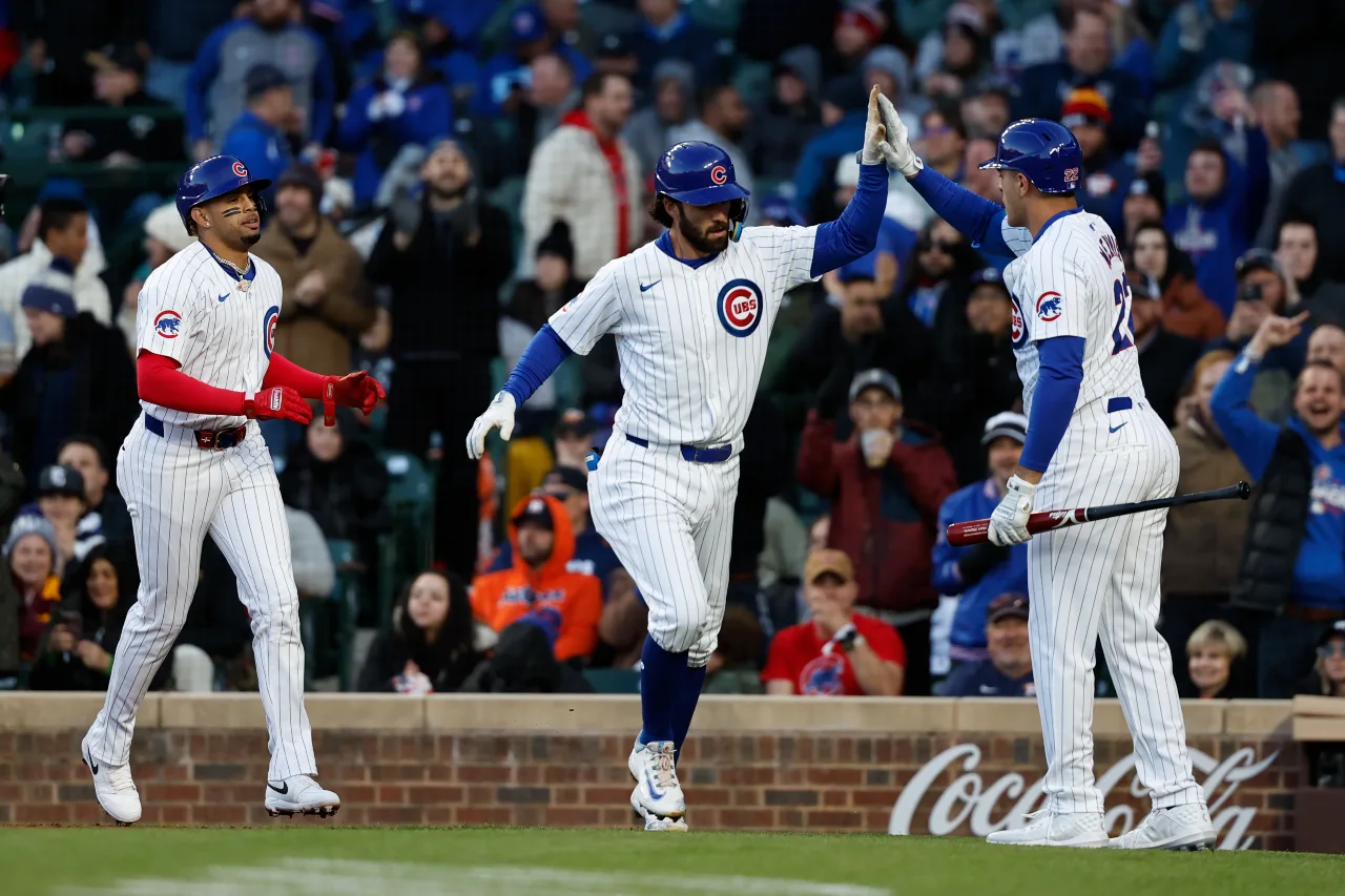 Chicago Cubs shortstop Dansby Swanson (7) celebrates with teammates after hitting a three-run home run against the