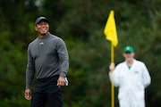 Tiger Woods smiles on on the fifth green during a practice round in preparation for the Masters at Augusta National Golf Club Tuesday, April 9, 2024, in Augusta, Ga. Woods, a 5-time champion, will be making his 26th appearance in the tournament. (AP Photo/Matt Slocum)
