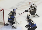 Hershey Bears right wing Matthew Phillips (11) puts a shot on goal that was blocked by Cleveland Monsters goalie Jet Greaves (73) in the first period at Rocket Mortgage FieldHouse. 