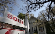 A SOLD sign is posted in front of a home on the corner of French Street and Lake Road in Lakewood, Ohio, Thursday, April  22, 2010. For Business story on the sharp rise in Northeast Ohio home sales in April.  (Peggy Turbett / The Plain Dealer) ORG XMIT: CLE2013121916384119 ORG XMIT: CLE1407281412546390