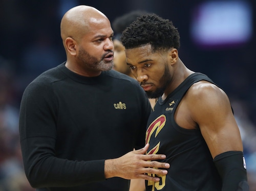 Cleveland Cavaliers head coach J.B. Bickerstaff talks with Cleveland Cavaliers guard Donovan Mitchell during a timeout