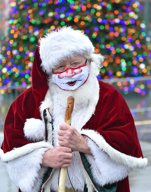 Santa Claus (George Smith) wears a mask in Syracuse's Clinton Square on Dec. 1, 2020.