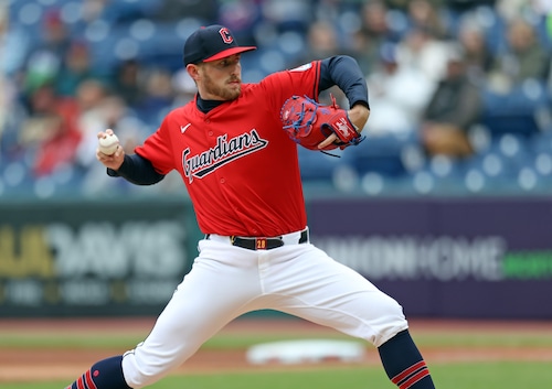 Cleveland Guardians starting pitcher Tanner Bibee pitches against the Oakland Athletics in the first inning.