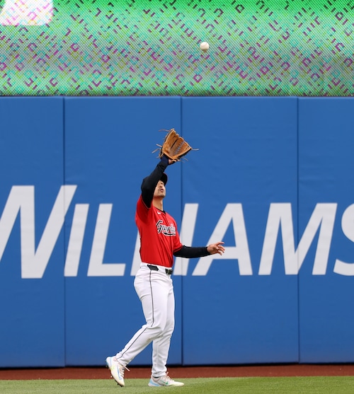 Oakland Athletics center fielder JJ Bleday flies out to Cleveland Guardians left fielder Steven Kwan in the first inning.