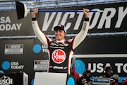 Christopher Bell hold up a broom after winning the NASCAR Cup Series race at New Hampshire Motor Speedway, Sunday, June 23, 2024, in Loudon, N.H. Bell is also racing in the Ally 400 on June 30; find out how you can watch for free if you don't have cable. (AP Photo/Steven Senne)