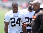 Cleveland Browns running back Nick Chubb laughs with running backs coach Duce Staley following Cleveland Browns mandatory minicamp in Berea Thursday. 