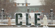 A pedestrian works their way through Public Square in downtown Cleveland. 