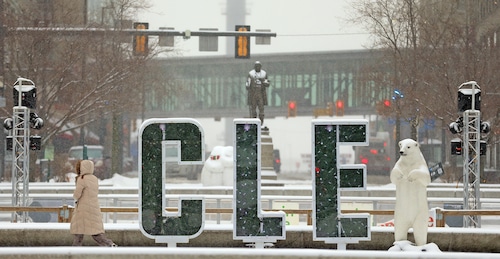 A pedestrian works their way through Public Square in downtown Cleveland.