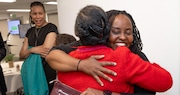 Transformative Care Continuum program graduate Persis Kibera, facing the camera, embraces Cleveland Clinic family physician Dr. Kendalle Cobb during an event celebrating the June graduation of the program’s first cohort. The program, a collaboration between the Cleveland Clinic and Ohio University, addresses the national shortage of primary care physicians by providing an accelerated pathway for students to become doctors. After graduating from their residencies at the end of June, four of the seven new doctors are expected to join the Clinic as full-fledged doctors. All of the program participants were celebrated at a graduation event held recently at Clinic SouthPointe Hospital, the Clinic said.