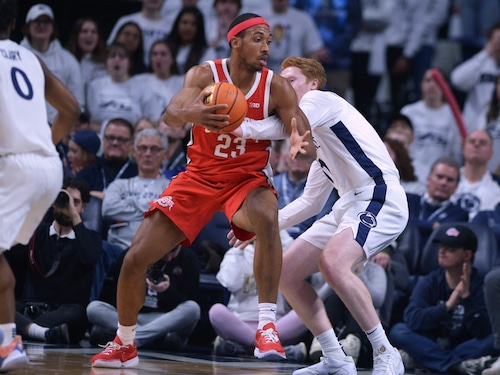 Penn State's Leo O'Boyle,right, reaches to attempt to knock the ball away from Ohio State's Zed Key (23) during the first half of an NCAA college basketball game Saturday, Dec. 9, 2023, in State College, Pa. (AP Photo/Gary M. Baranec)