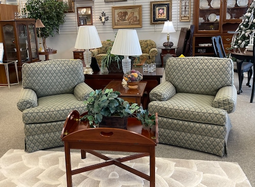 Two upholstered chairs and a coffee table