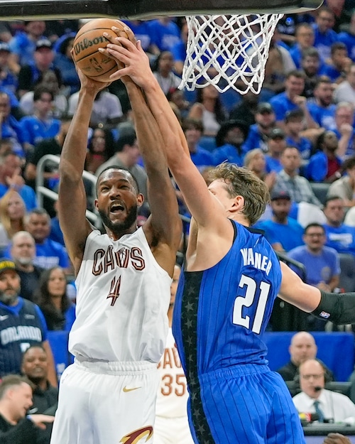 Cleveland Cavaliers forward Evan Mobley (4) is fouled by Orlando Magic center Moritz Wagner (21) while attempting a shot during the first half of Game 4 of an NBA basketball first-round playoff series, Saturday, April 27, 2024, in Orlando, Fla. (AP Photo/John Raoux)