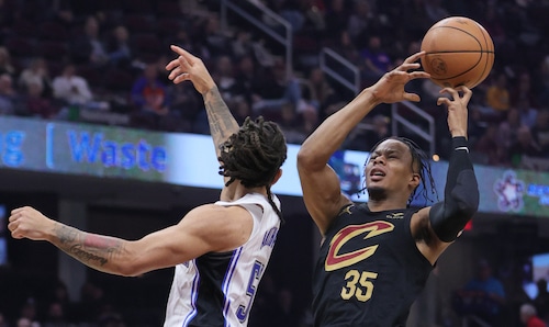 Cleveland Cavaliers forward Isaac Okoro loses control of the basketball by the defense of Orlando Magic guard Cole Anthony for a turnover