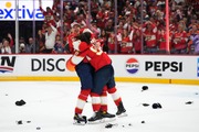 Florida Panthers defenseman Niko Mikkola, left, and left wing Ryan Lomberg, right, hug after winning the NHL hockey Stanley Cup Final against the Edmonton Oilers, Monday, June 24, 2024, in Sunrise, Fla. (AP Photo/Wilfredo Lee)