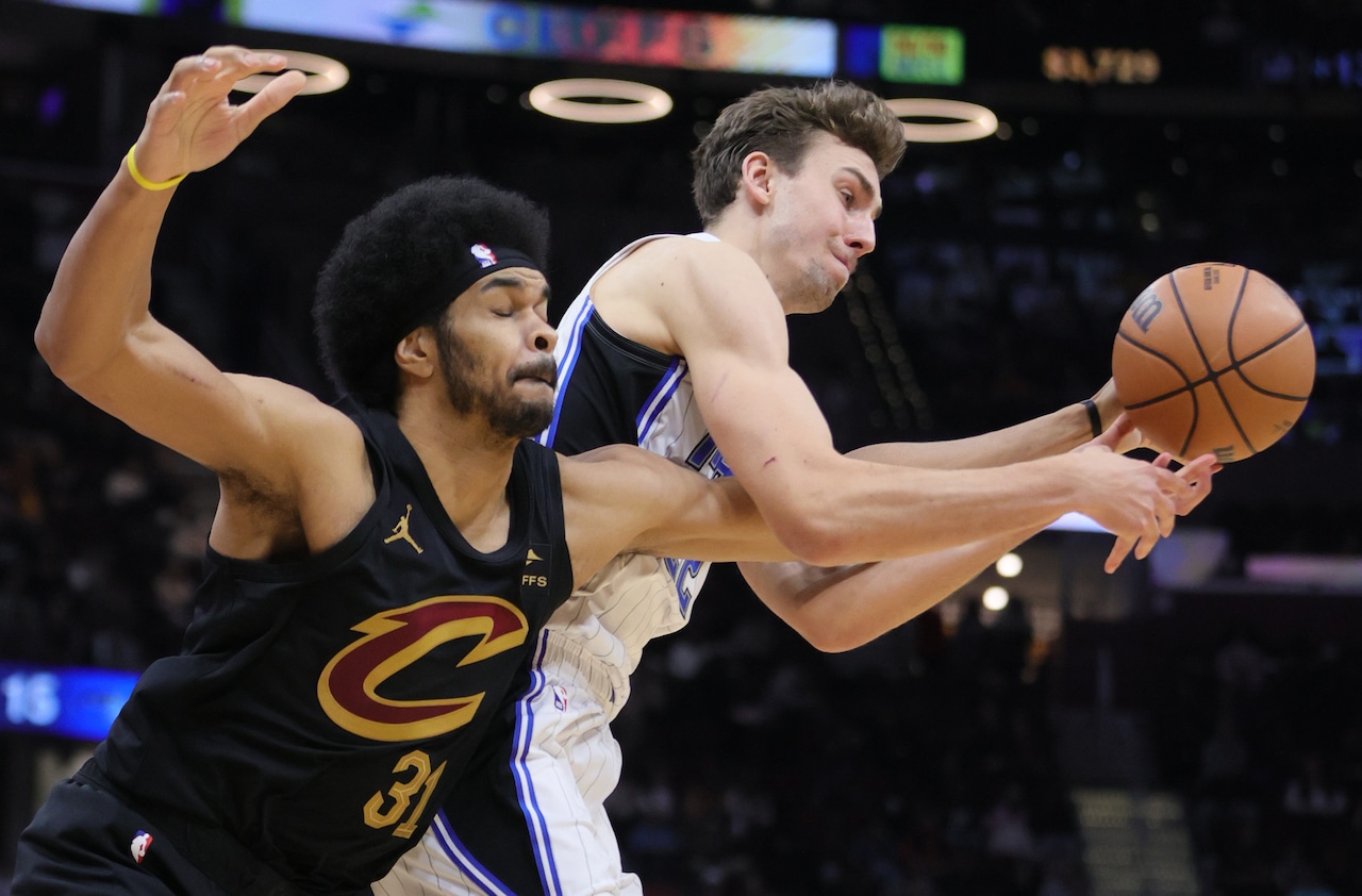 Cleveland Cavaliers center Jarrett Allen and Orlando Magic forward Franz Wagner battle for possession of a rebound in the second half