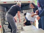 Campaign workers with the Citizens Not Politicians redistricting amendment unload boxes of petitions at a loading dock for the Ohio Secretary of State's Office in Columbus on Monday, July 1, 2024.
